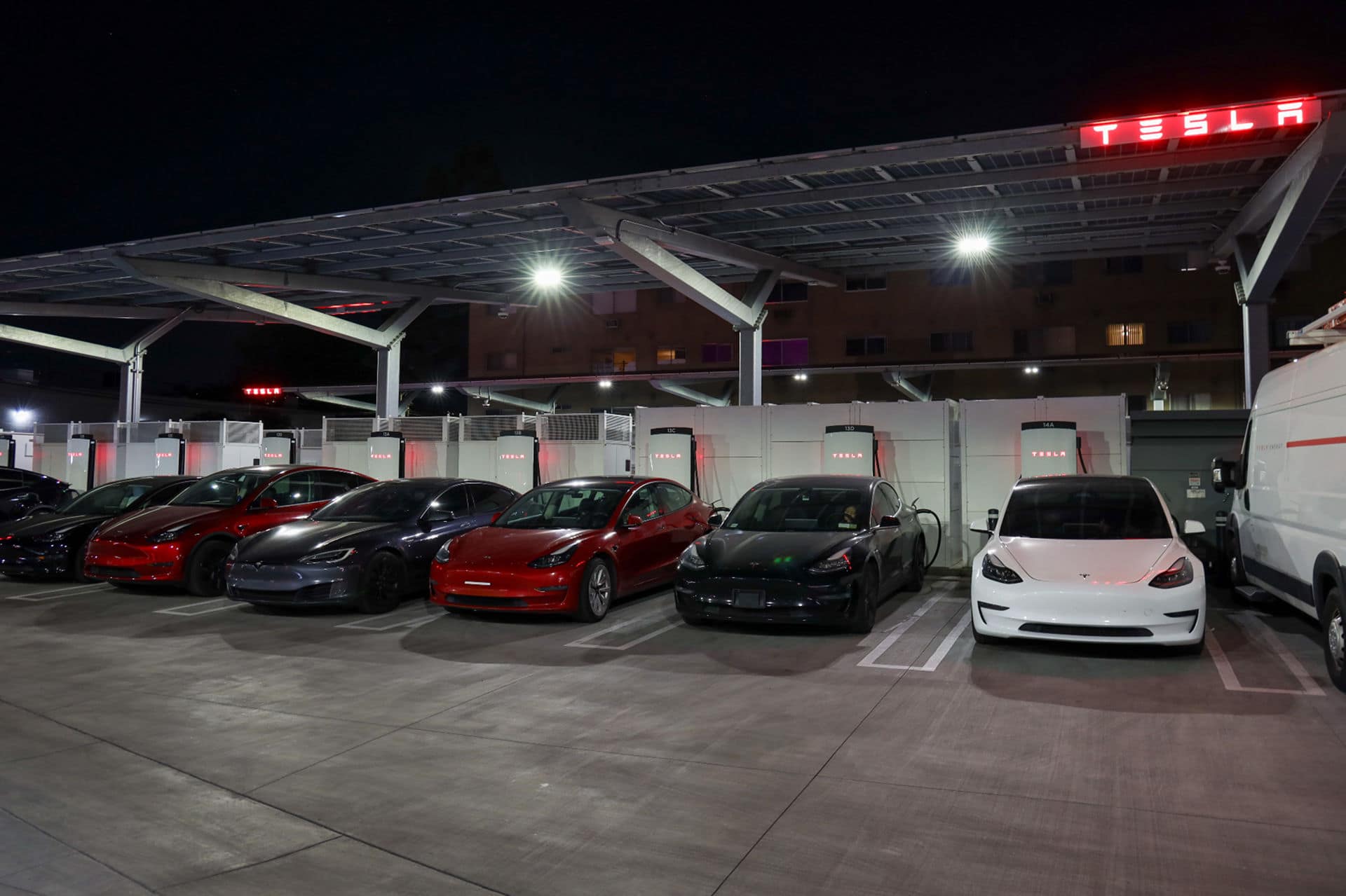 Tesla EV charging station at night