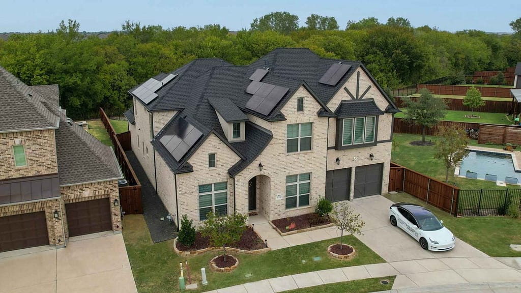 huge brick house with multiple solar panels installed