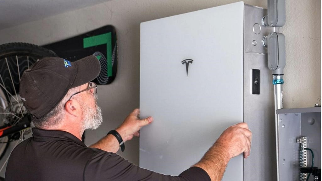 Person Installing a Tesla PowerWall