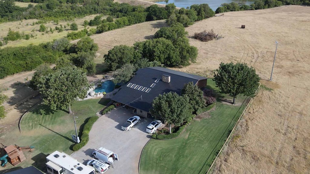 house with solar roof in the middle of the field