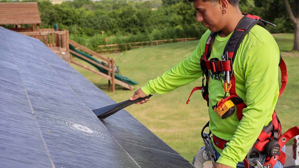 Good Faith Energy Worker Replacing hail damaged tile
