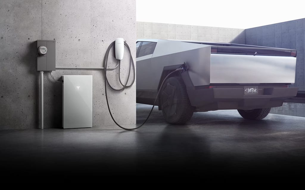 a cybertruck charging next to a tesla powerwall