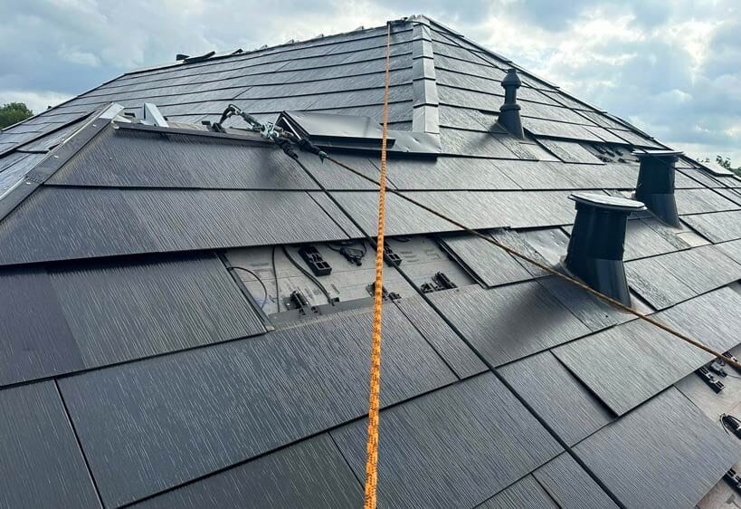 solar installer on roof