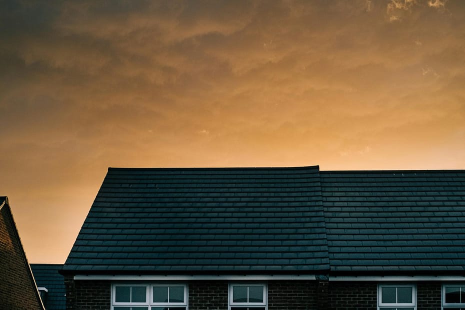 houses with solar roof over sunset view