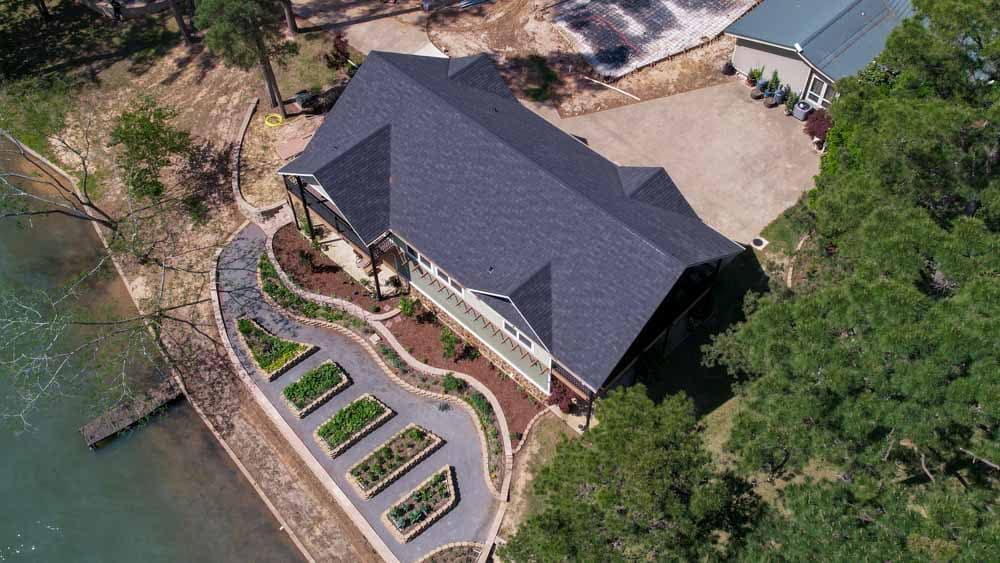lake house with gray colored roof shingles