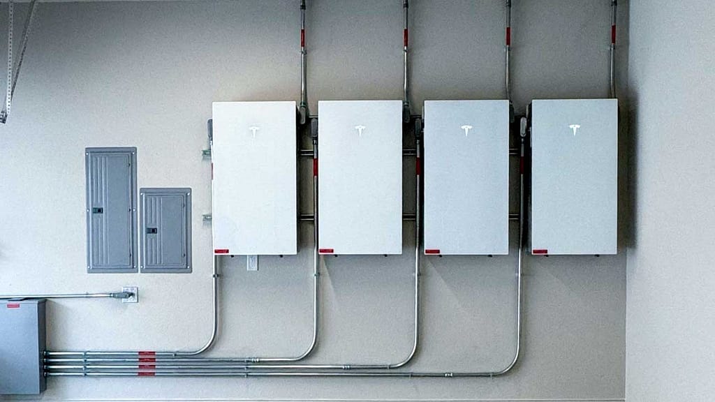 row of powerwall 3s in a garage