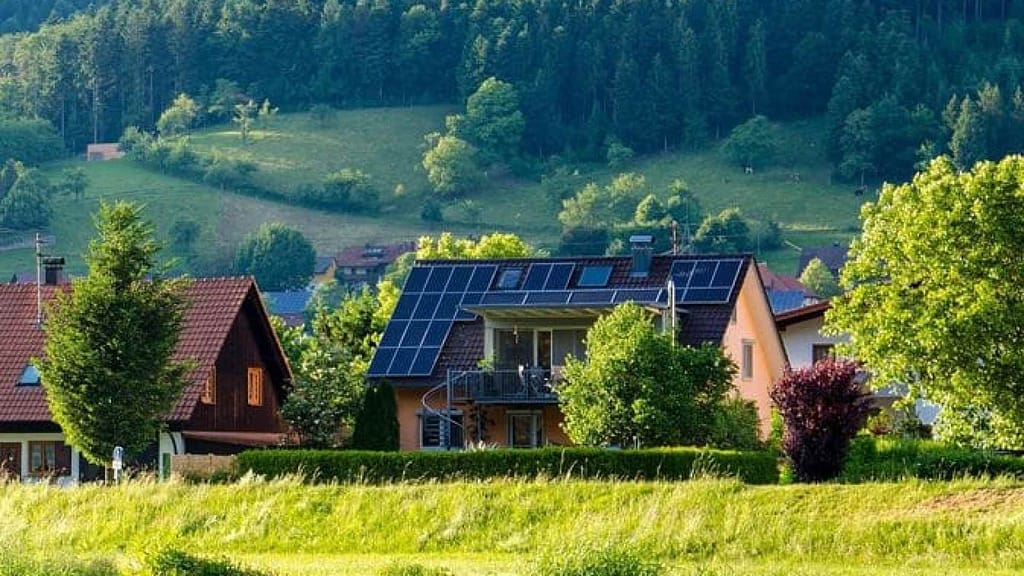 house using solar panels over greenery view