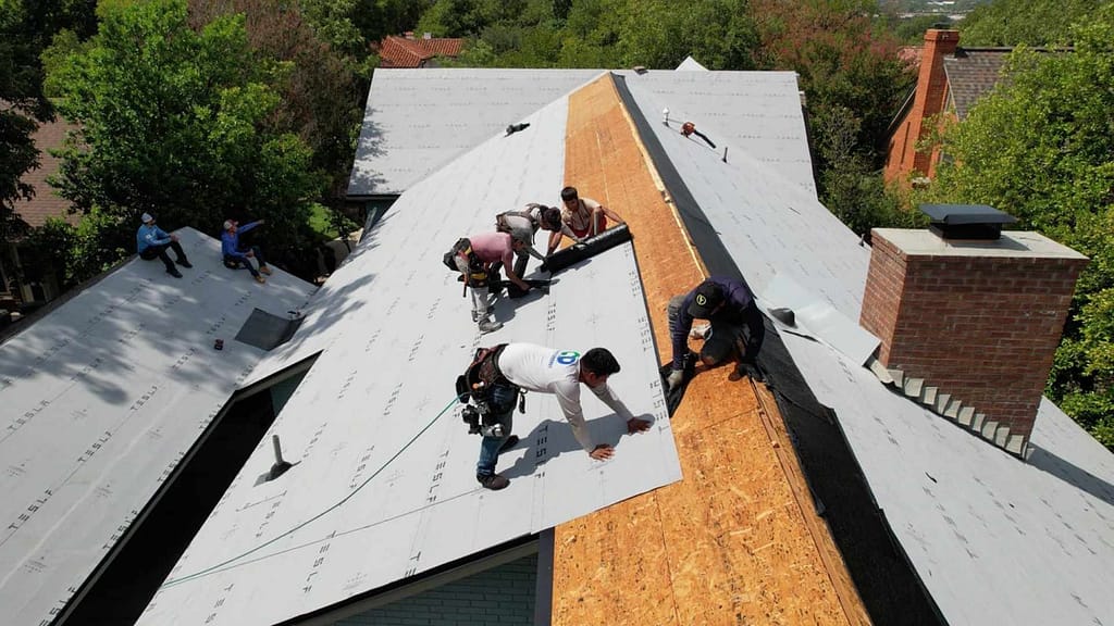Good faith energy roofers installing tesla roof