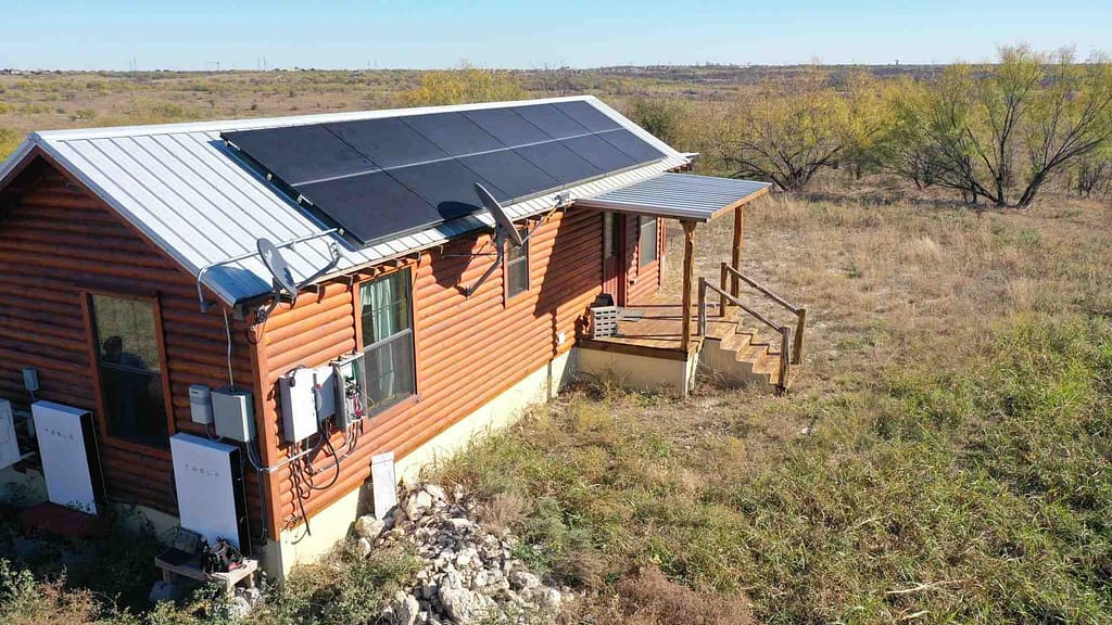 tiny house using roof solar panels and Tesla Powerwall