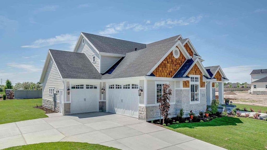 white beautiful house with gray roof by Trusted Texas roofing contractor 