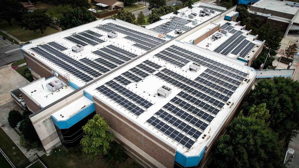 large numbers of solar panels installed in huge a building