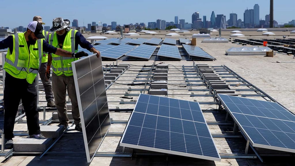Good Faith Energy team installing multiple solar panels in commercial areas