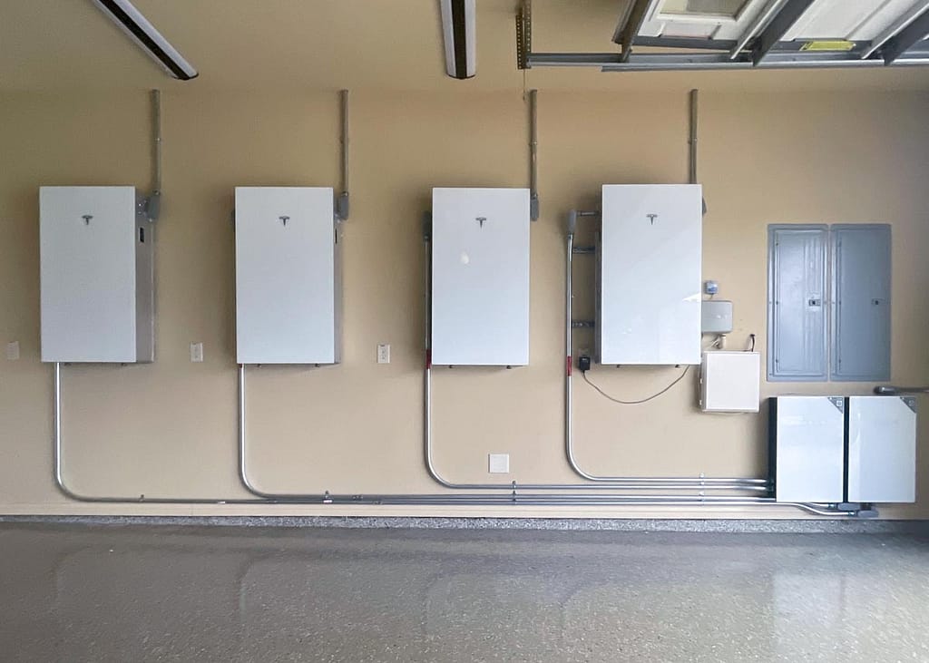 four Tesla Powerwall 3s mounted on a wall