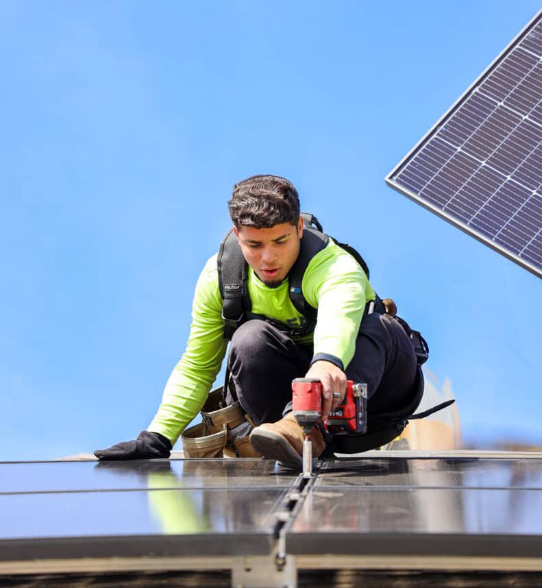 person installing solar panels